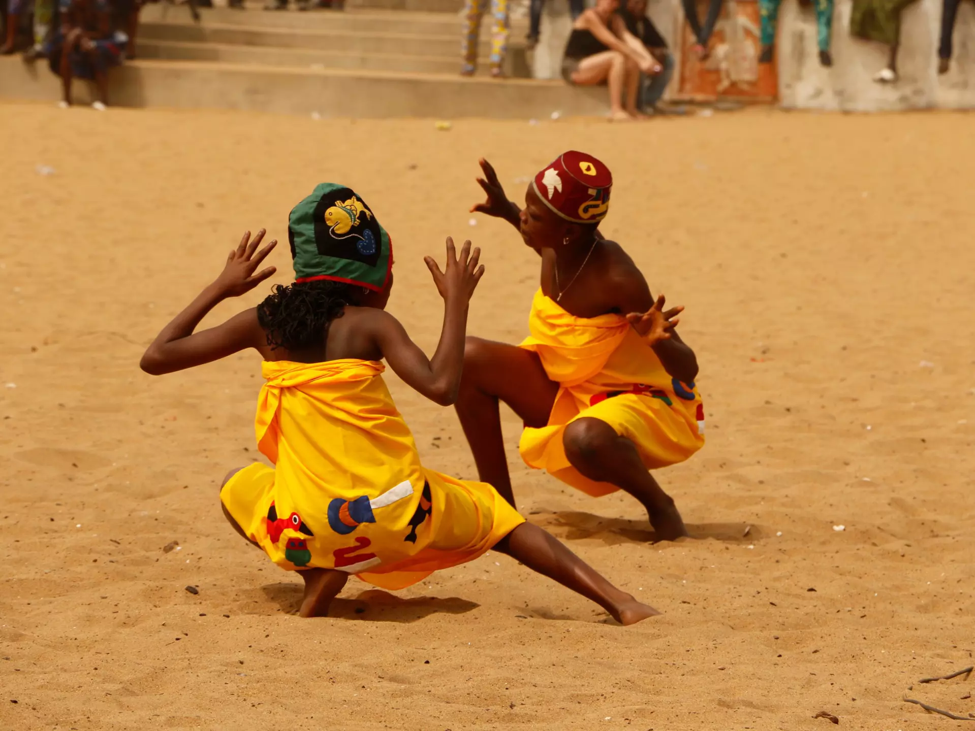 Children dancing on the beach during a Vodou festival in Benin © Cora Unk Photo / Shutterstock