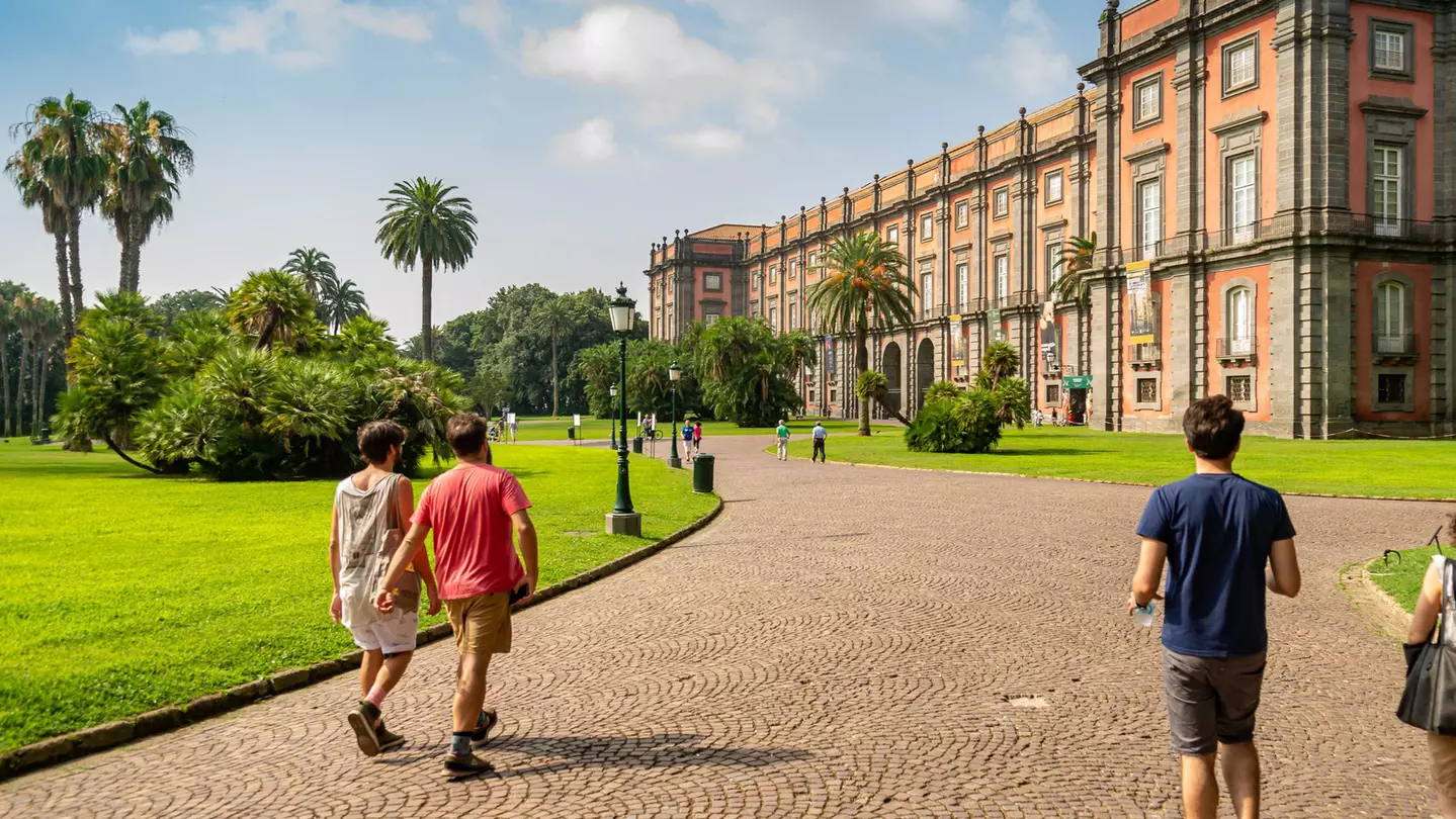 People walk through the park towards the Palazzo Real di Capodimonte, one of the most important Italian museums