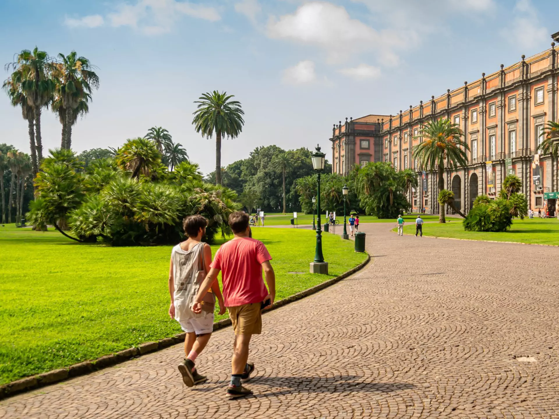 People walk through the park towards the Palazzo Real di Capodimonte, one of the most important Italian museums