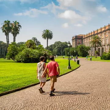People walk through the park towards the Palazzo Real di Capodimonte, one of the most important Italian museums