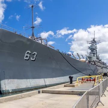 OAHU, HI - AUG 5, 2016: The USS Missouri battleship on August 5, 2016 in Pearl Harbor, USA. Site of the treaty signing ending WWII between the US and Japan, is now berthed in Pearl Harbor.; Shutterstock ID 471139421;