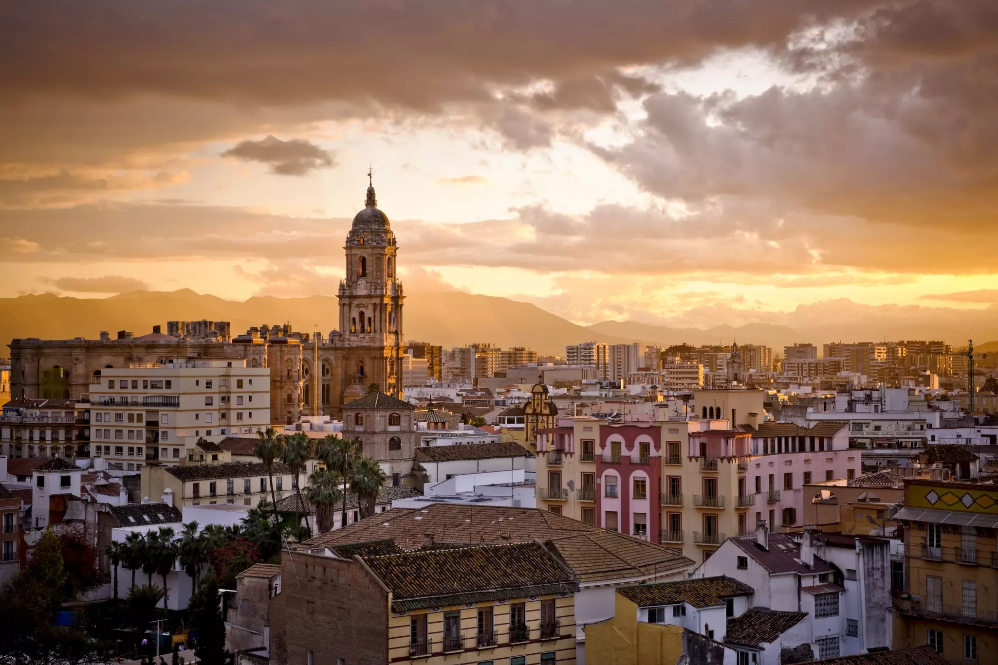 View of the city of Malaga, capital of the Costa del Sol (southern Spain), at the sunset.
157586726
Malaga, No People, Cloudscape, Multi Colored, Urban Scene, Outdoors, Horizontal, Málaga Province, Sunset, Cloud - Sky, Cathedral, Cityscape, City, Travel Locations, Architecture And Buildings, Landmarks, Places Of Worship