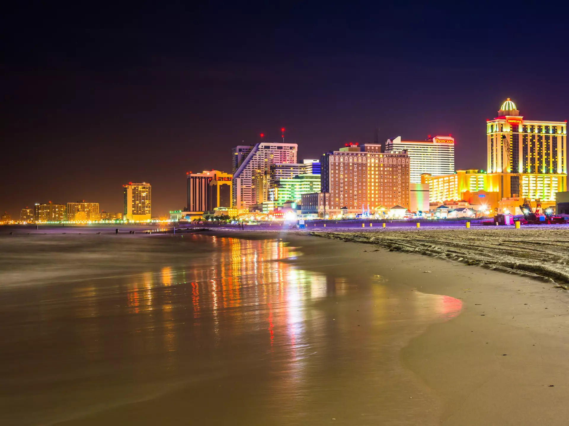 Atlantic City skyline lit up at night, as seen from the beach.
213973513
downtown, coast, shore, travel, waterfront, sand, urban, architectural, bright, night, scenery, skyline, light, clouds, building, dark, modern, casinos, beach, reflection, architecture, city, blue, outdoors, sky, scenic, hotels, tourism, sea, beautiful, water, nature, landscape, ocean, new, exposure, jersey, long, atlantic