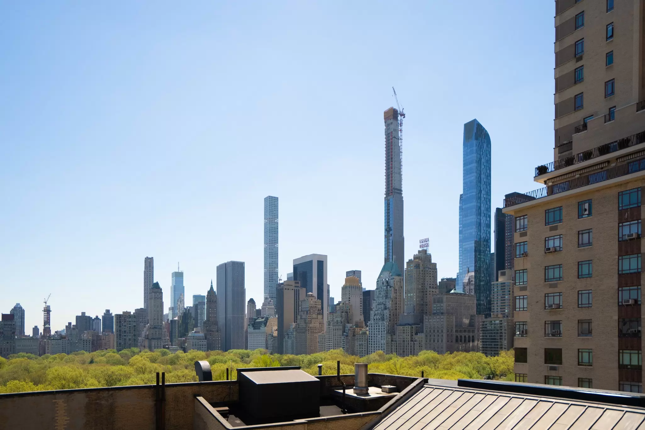 Views of a city skyline, with many glass skyscrapers, from a terrace at West Side YMCA, New York City. 