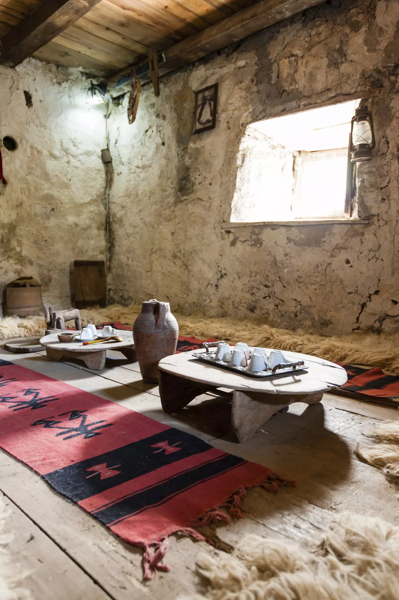 Low tables and geometric rugs laid out inside the lock-in tower