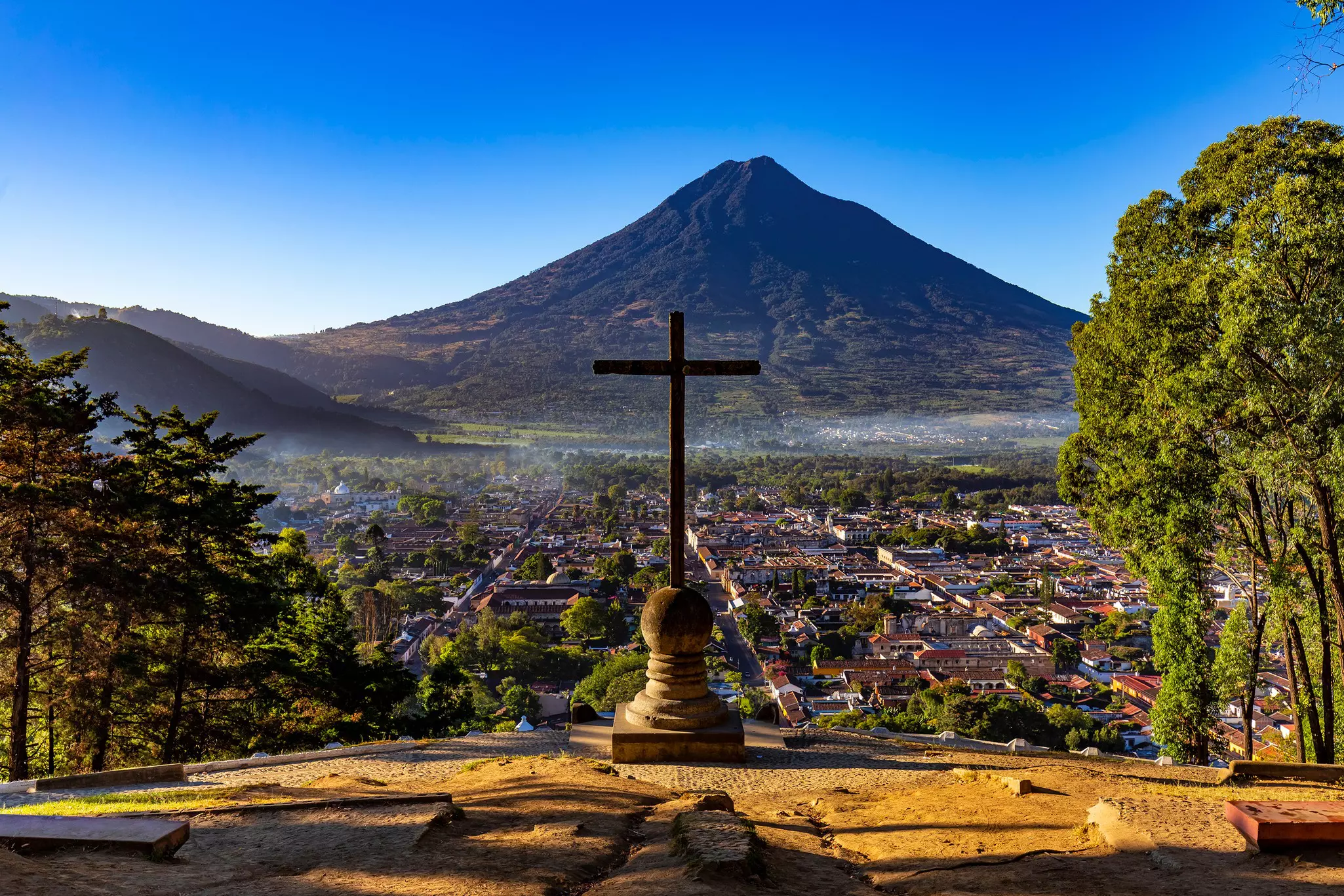 Guatemala. Antigua. Cerro de la Cruz - viewpoint over town, there is Agua volcano opposite the cross