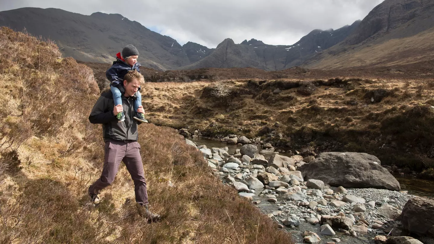 Father and son hiking, Fairy Pools, Isle of Skye, Hebrides, Scotland
