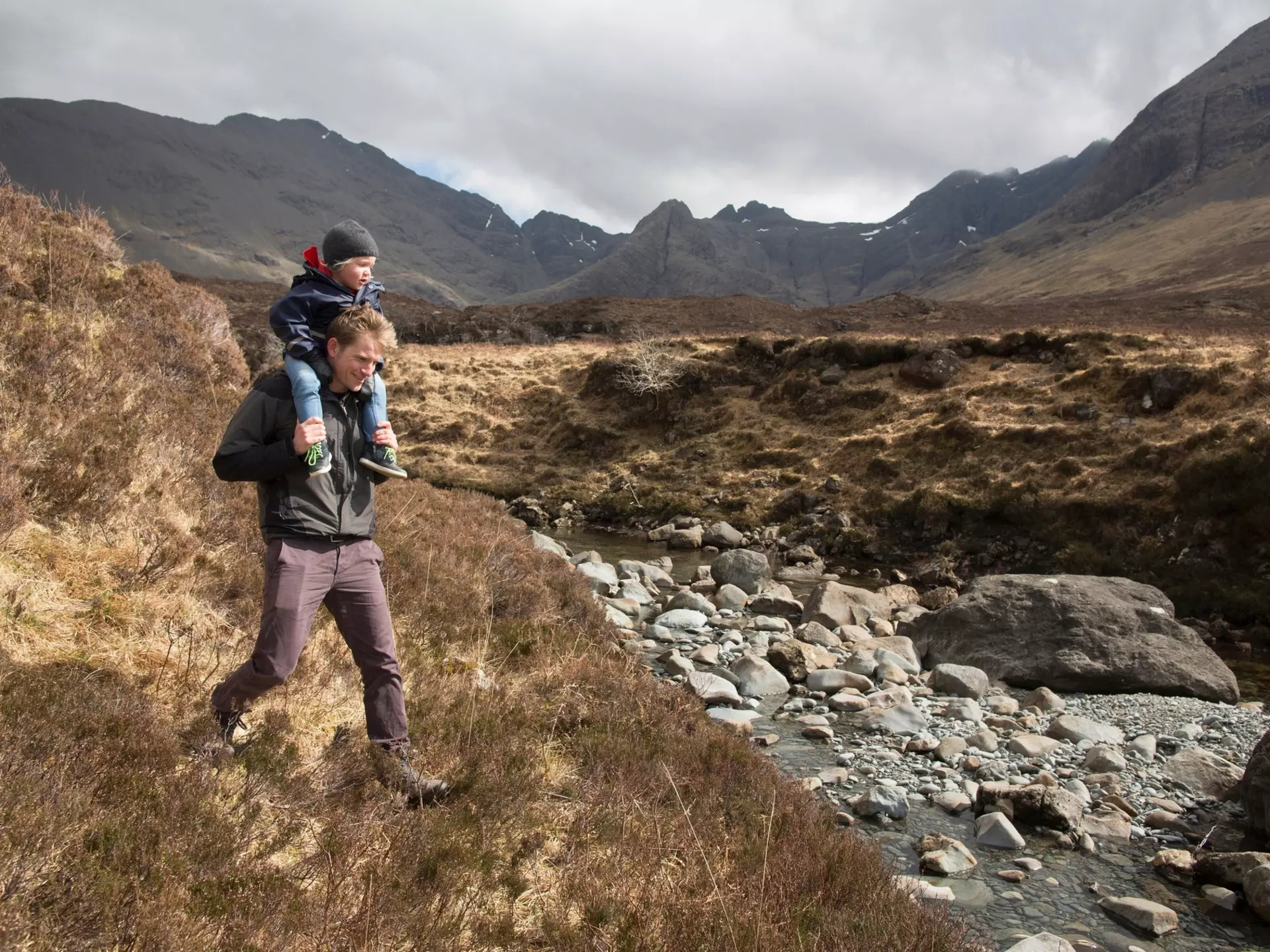 Father and son hiking, Fairy Pools, Isle of Skye, Hebrides, Scotland
