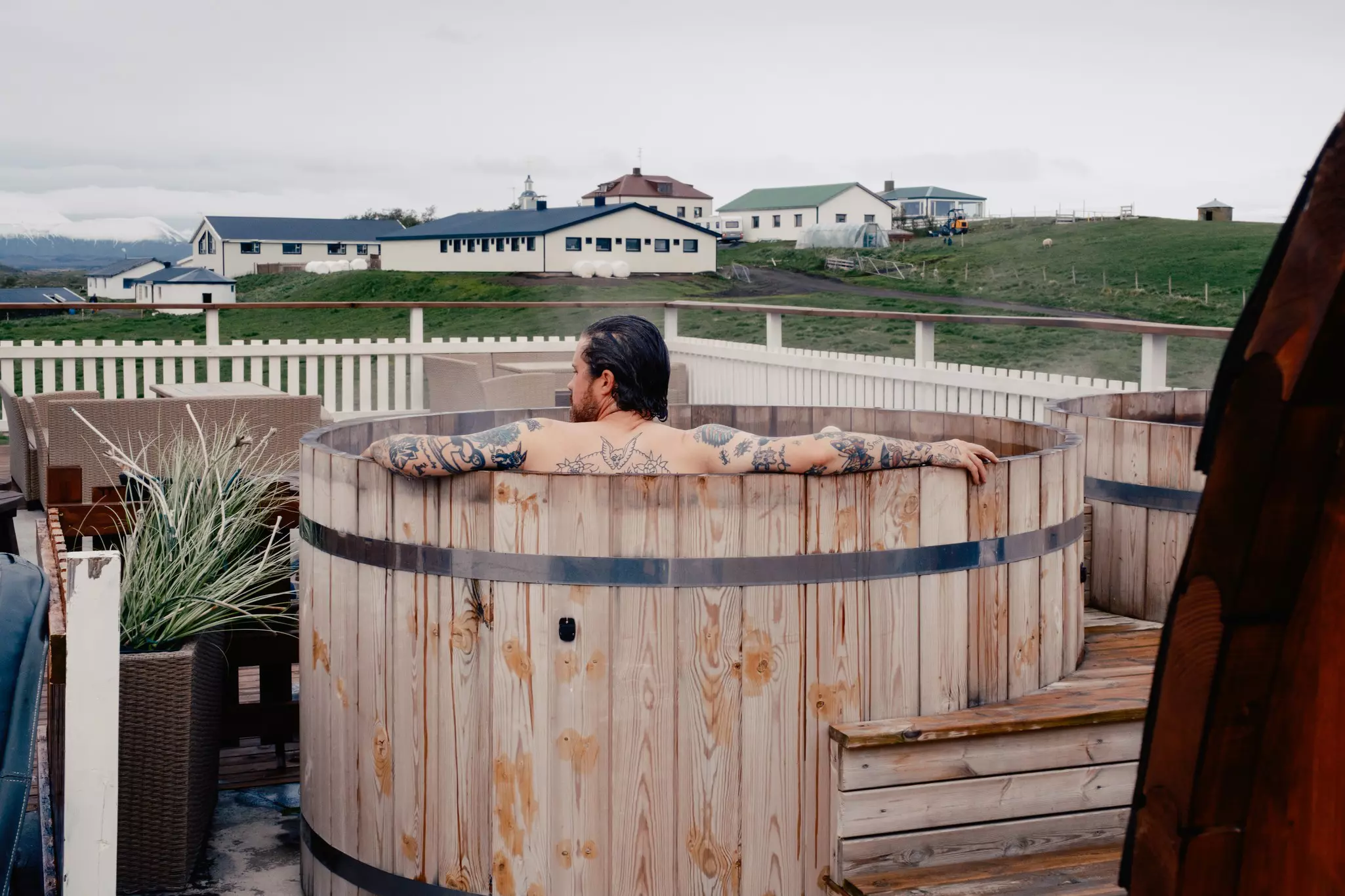 A guest in the hot pots at the  Sel-Hotel Mývatn in Iceland. 
