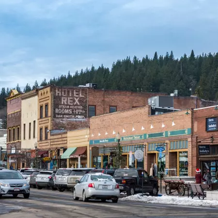 Single-story buildings with shops on a town's main road.