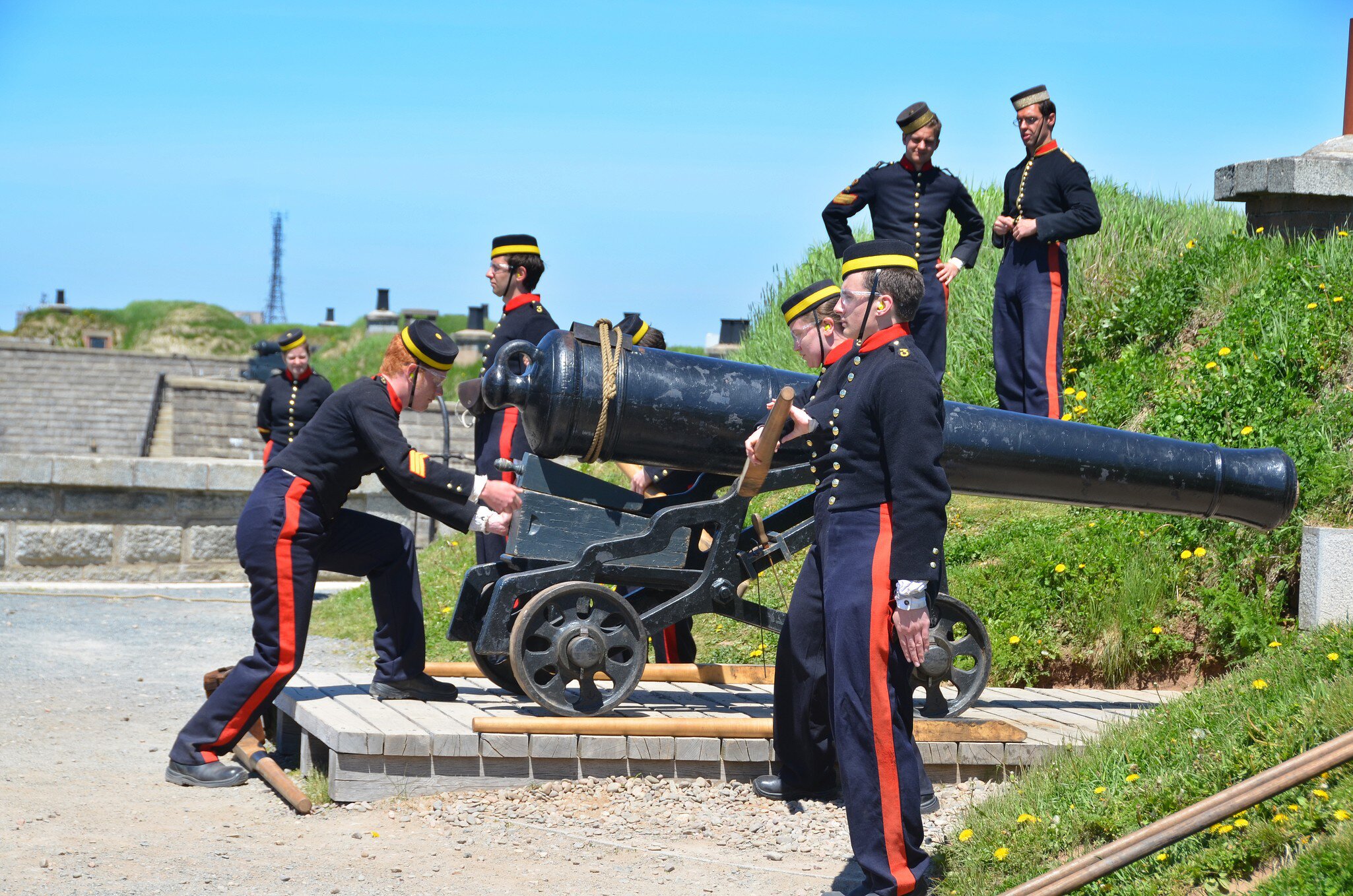 Soldiers in historic uniforms fire the daily noon cannon at Citadel Hill (Fort George), Halifax, Nova Scotia, Canada