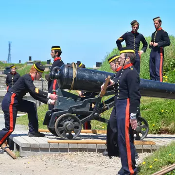 Soldiers in historic uniforms fire the daily noon cannon at Citadel Hill (Fort George), Halifax, Nova Scotia, Canada