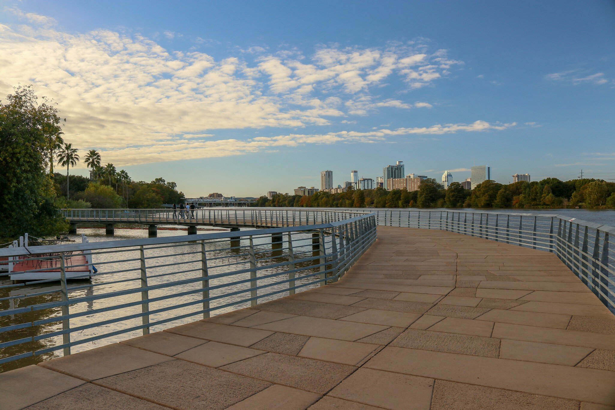 Lady Bird Lake Boardwalk, walking path along the Colorado River in Austin  Texas skyline.; Shutterstock ID 1221197338;