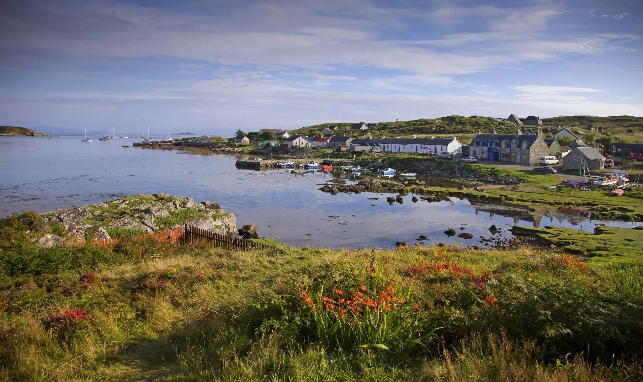 Waterside houses at Aringour Harbour on the Isle of Coll, Scotland