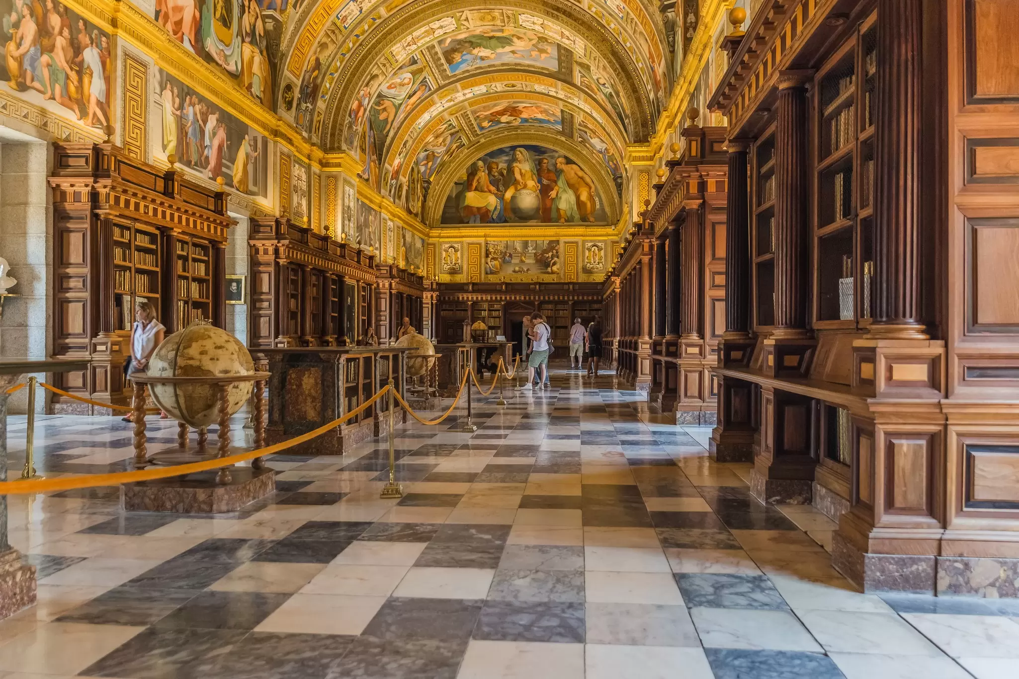 View of the royal library inside the Real Monasterio de San Lorenzo de El Escorial near Madrid, Spain.