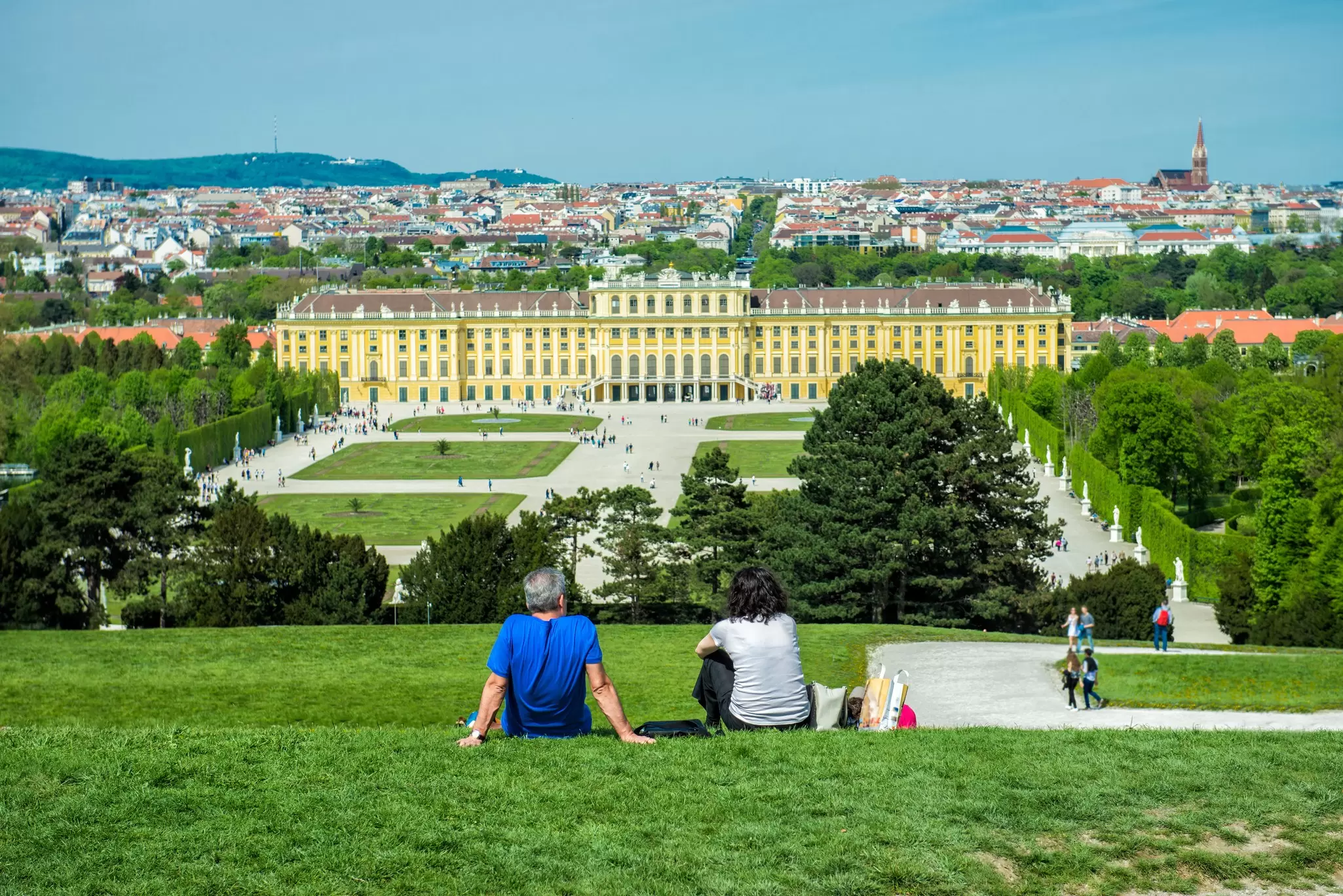 Visitors relaxing in the gardens of Schönbrunn Palace. Nick Starichenko/Shutterstock