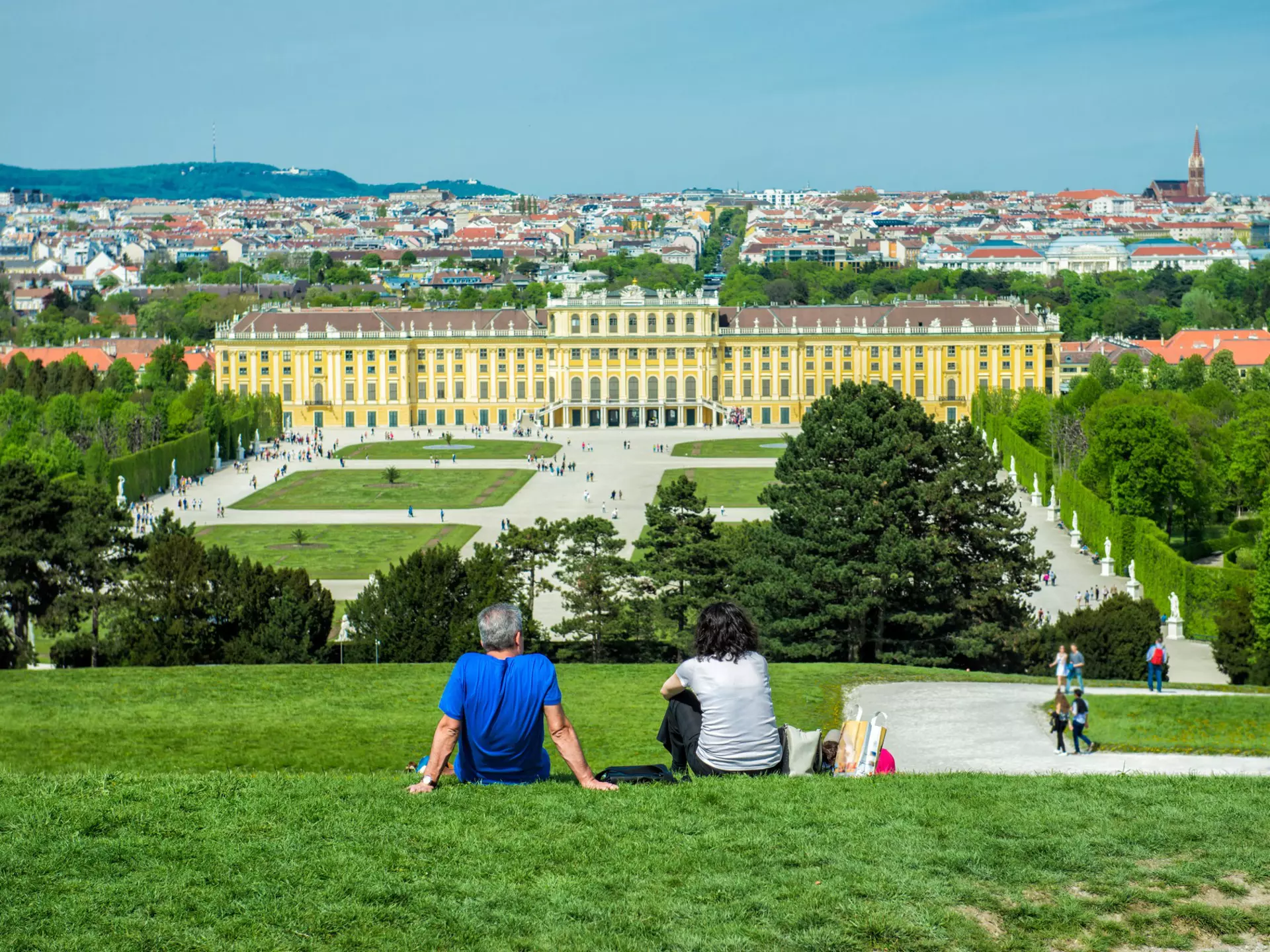 Visitors relaxing in the gardens of Schönbrunn Palace. Nick Starichenko/Shutterstock