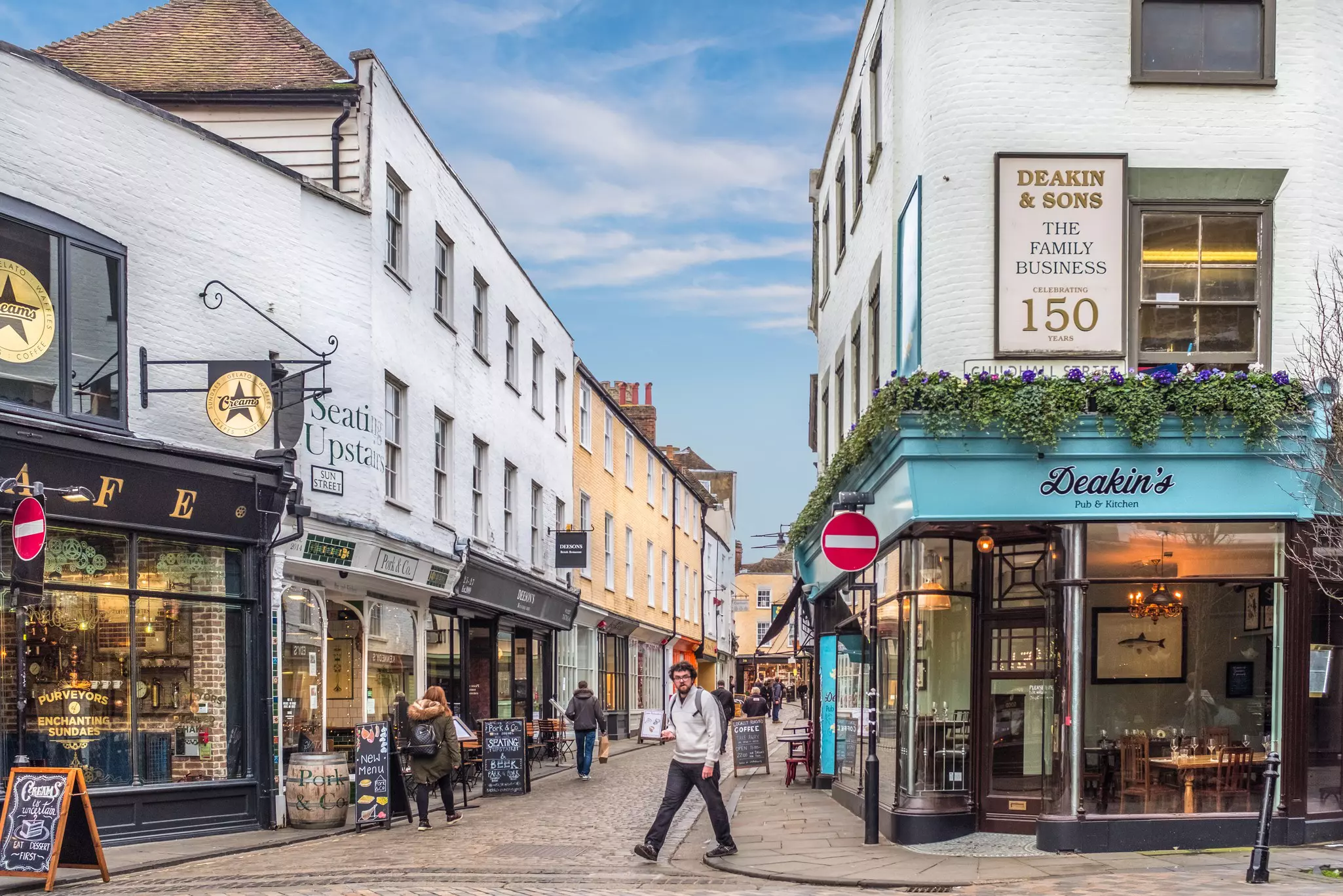 Canterbury, UK - Jan 29 2018. The cobbled paving of Sun St in the historic city of Canturbury. The street is pedestrianised and popular with tourists and locals for shopping, cafes and restaurants.