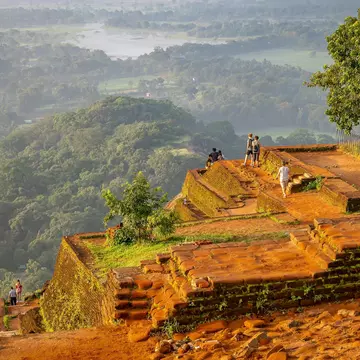Visitors at top of the rock fortress of Sigiriya, Sri Lanka. Wesche/Shutterstock