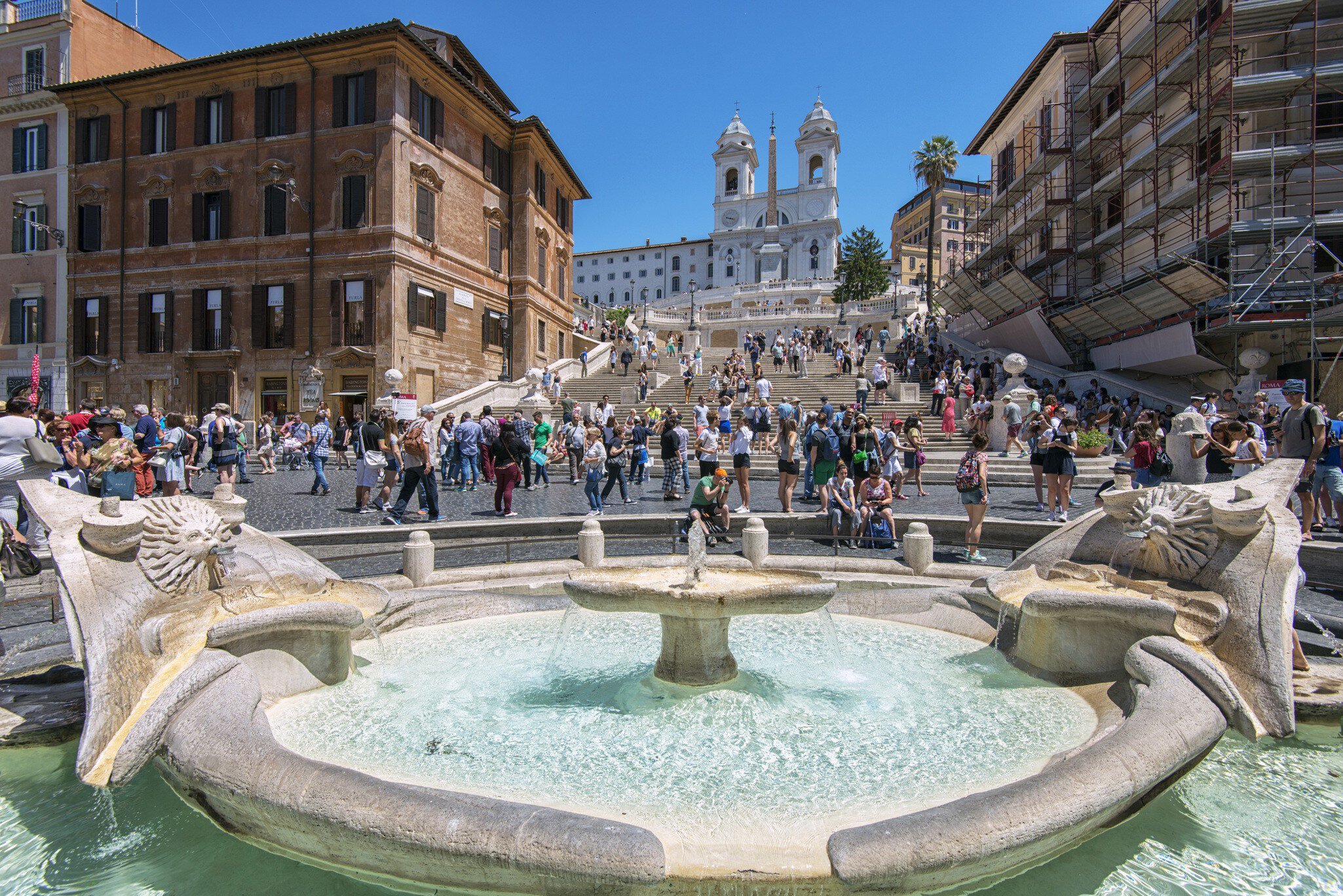 The Fontana della Barcaccia in Piazza di Spagna, at the bottom of the Spanish Steps in Rome, Italy.