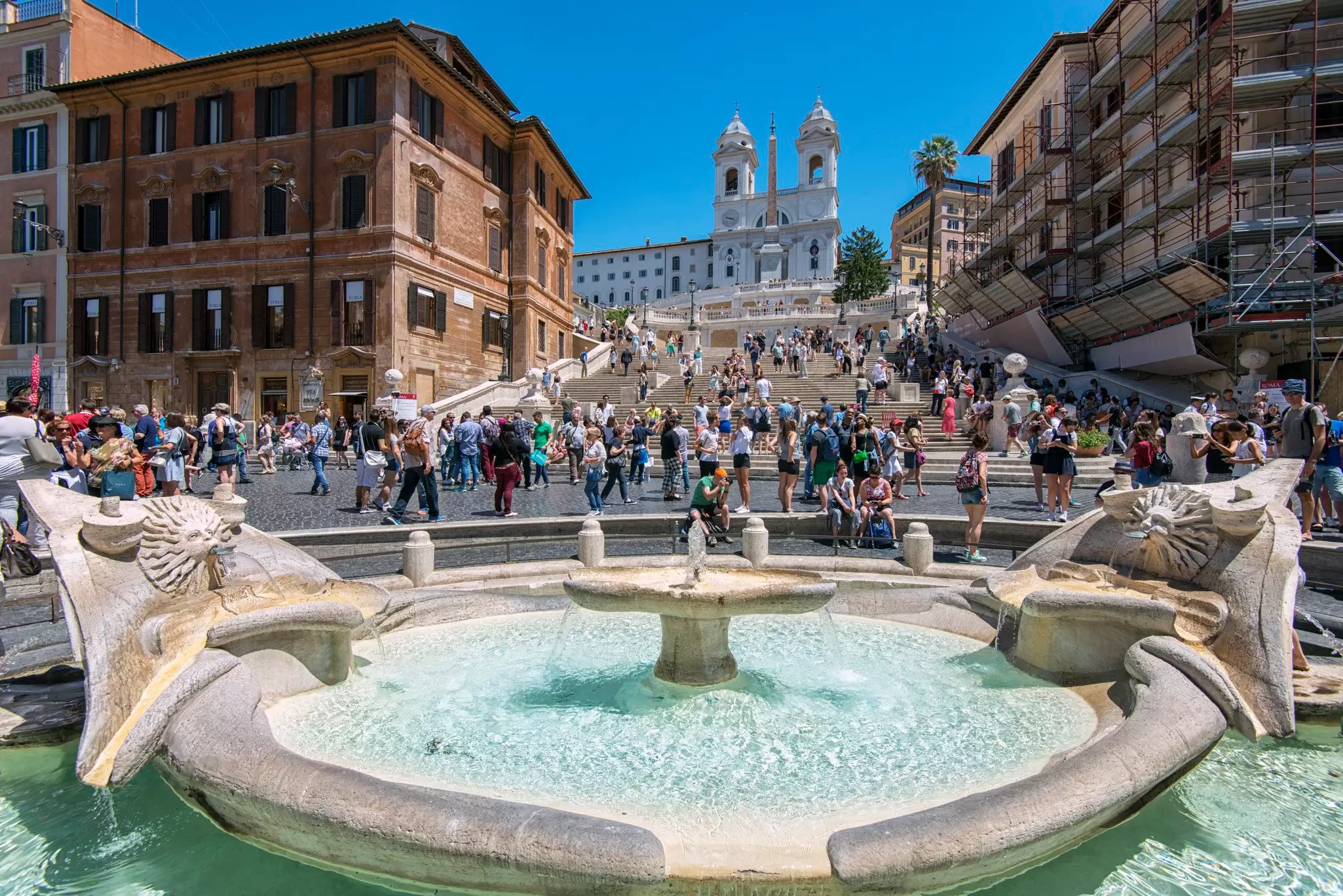 The Fontana della Barcaccia in Piazza di Spagna, at the bottom of the Spanish Steps in Rome, Italy.