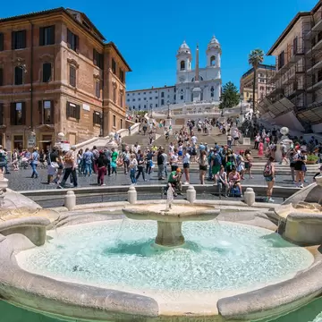 The Fontana della Barcaccia in Piazza di Spagna, at the bottom of the Spanish Steps in Rome, Italy.