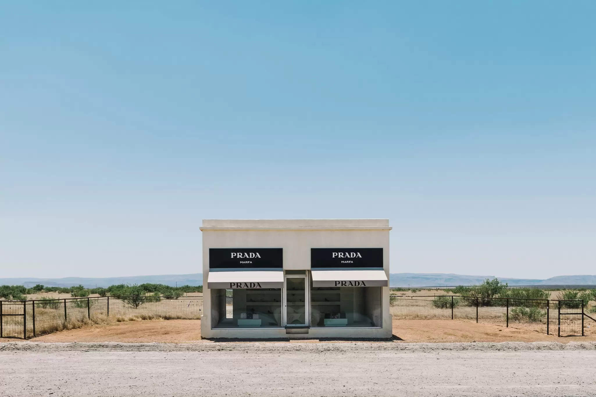 Valentine, Texas / USA June 16 2017 Prada Marfa Art Installation Sits On Display In The Middle Of Nowhere With Bright Blue Sky Above
1367585012
alone, america, architecture, art, artists, awning, background, blue, building, business, clouds, day, desert, desolate, dragset, elmgreen, fashion, highway, house, installation, isolated, landscape, marfa, nature, outdoor, outside, park, prada, remote, road, route, sculpture, shoes, shop, sign, sky, store, storefront, texas, tourism, transportation, travel, tx, valentine, view, white