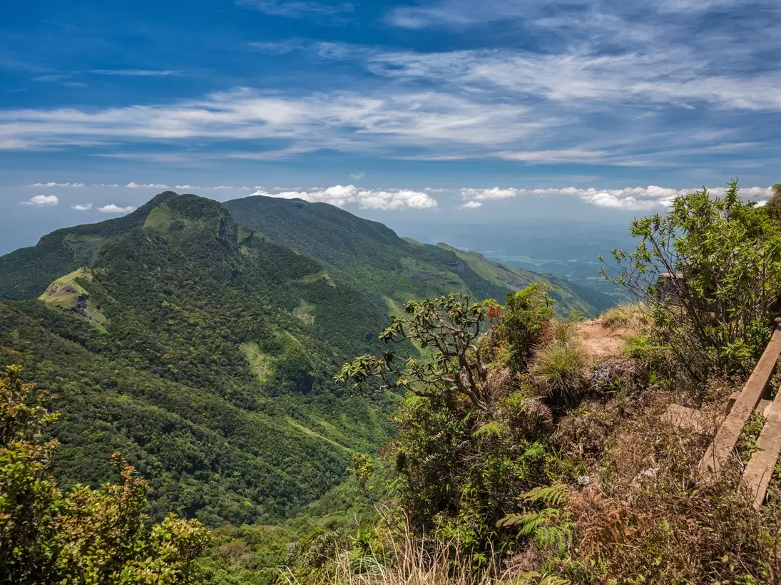 View of green valleys from the World's End viewpoint within the Horton Plains National Park in Sri Lanka.