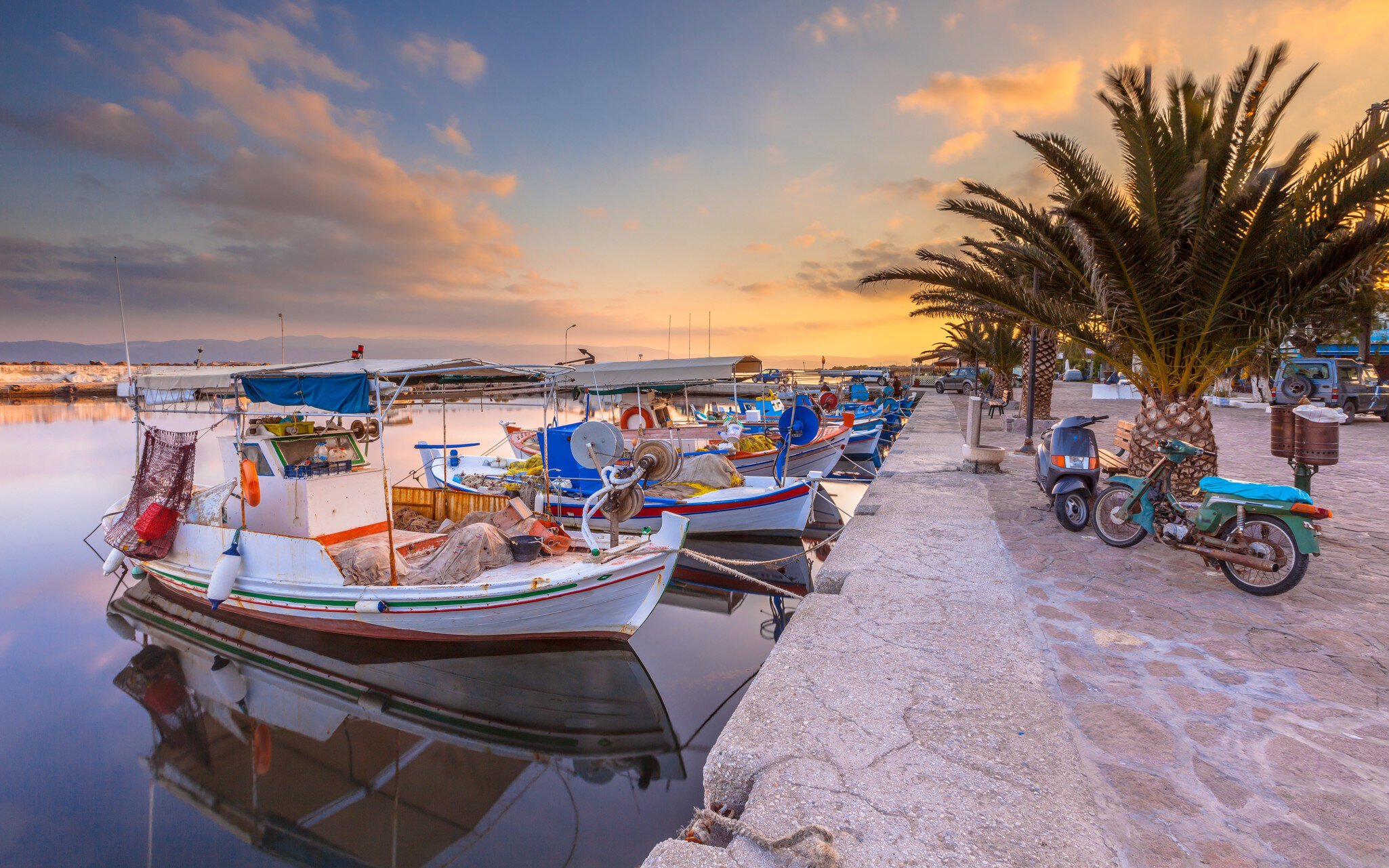 Fishing harbor scene in Greece with boats, palm trees and scooters at sunrise on a beautiful tranquil summer day
567308569
aegean, architecture, background, beautiful, blue, boat, building, colorful, crete, cyclades, europe, fish, fishing, greece, greek, harbor, holiday, honeymoon, hotel, hydra, island, lagoon, mediterranean, mykonos, naousa, old, paros, port, restaurant, rhodes, romantic, saronic, scene, sea, seascape, skiathos, sky, summer, symi, tourism, town, traditional, travel, vacation, view, village, water, white, wooden