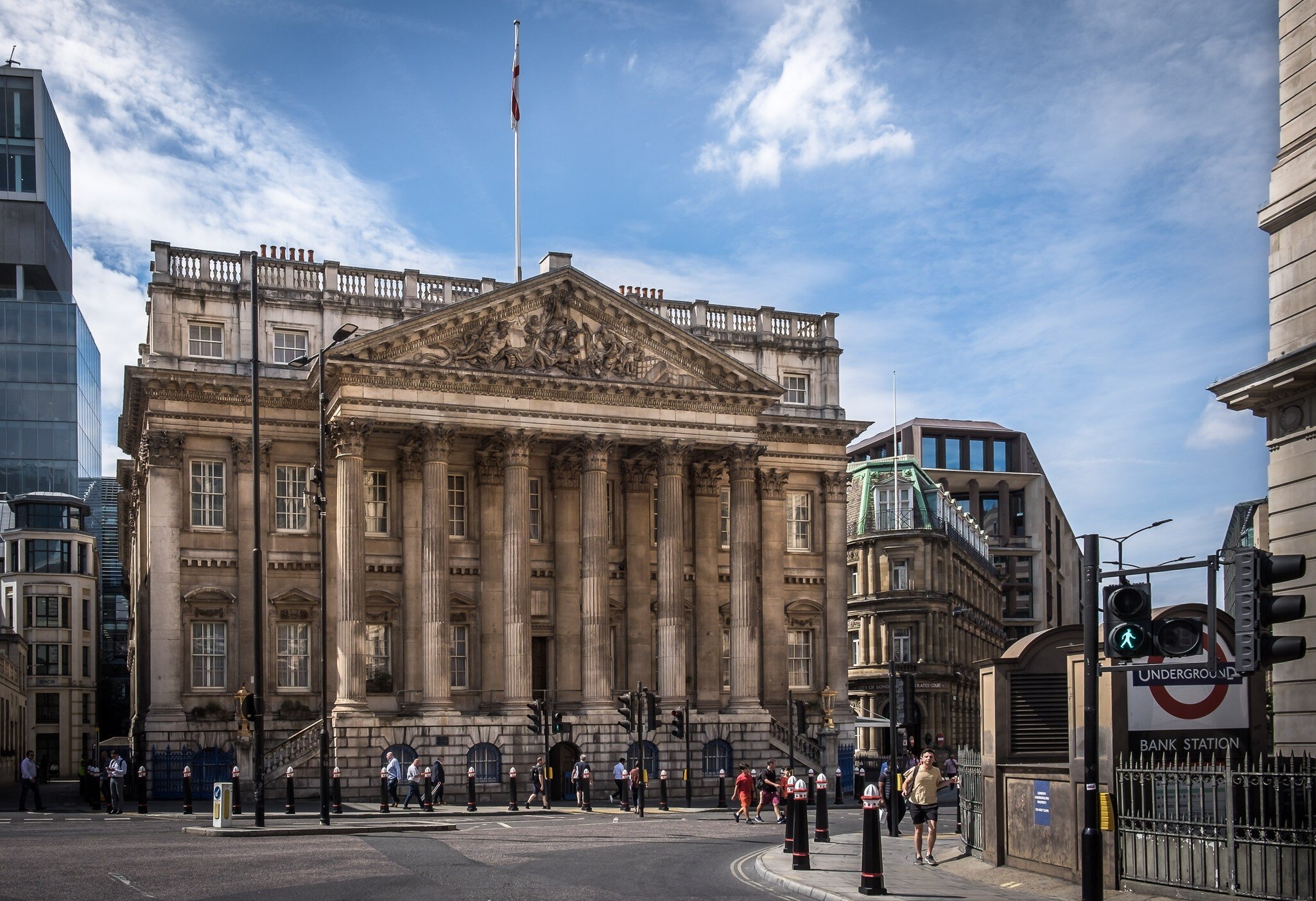 View of Mansion House by the Bank tube station on a summer day in London, UK.