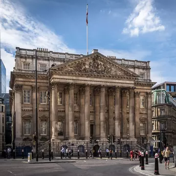 View of Mansion House by the Bank tube station on a summer day in London, UK.