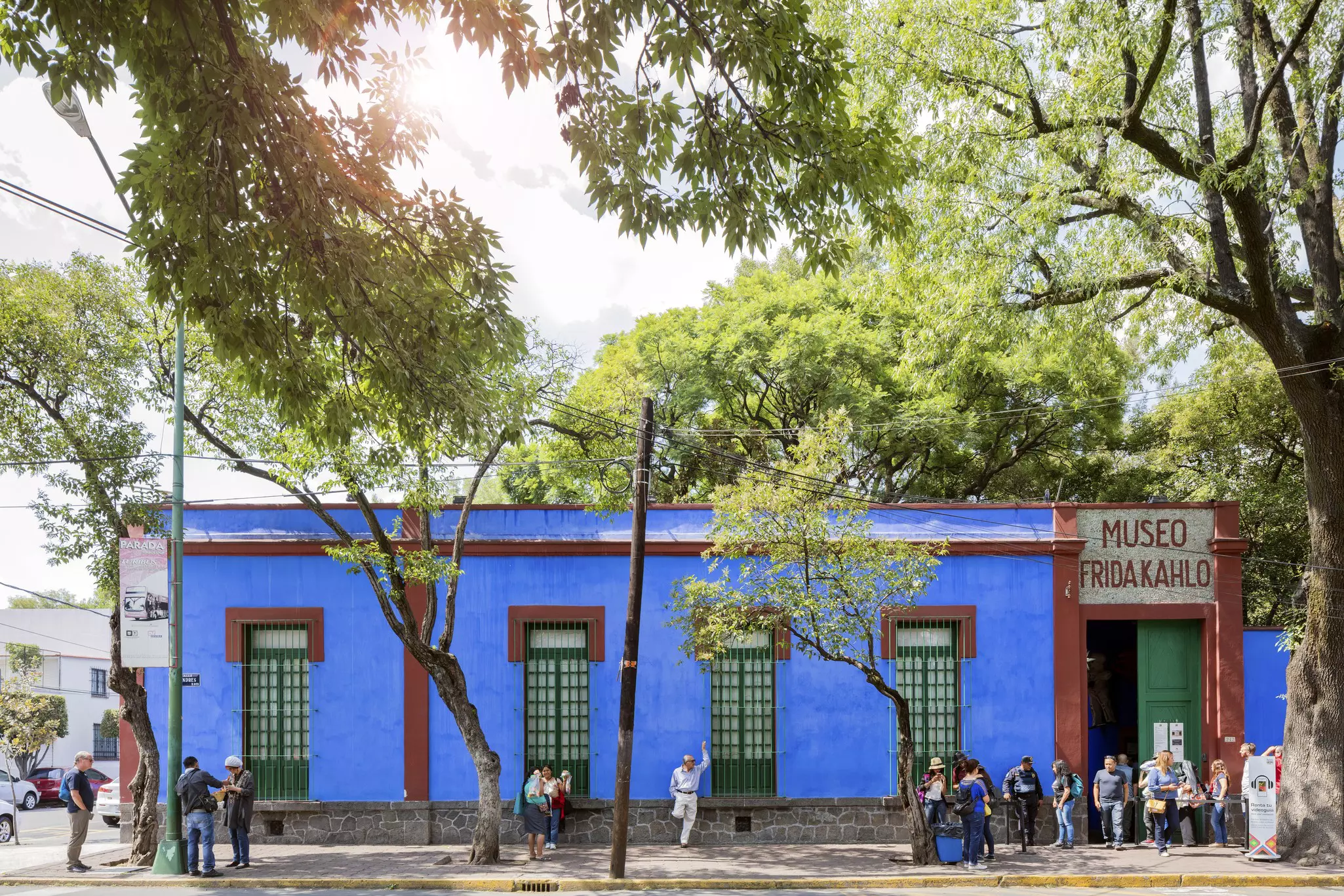 People outside of the Blue House (La Casa Azul), the former home of Mexican artist Frida Kahlo.
