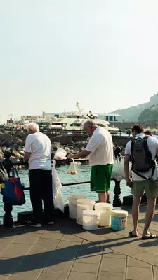Locals fishing off a pier in Amalfi.