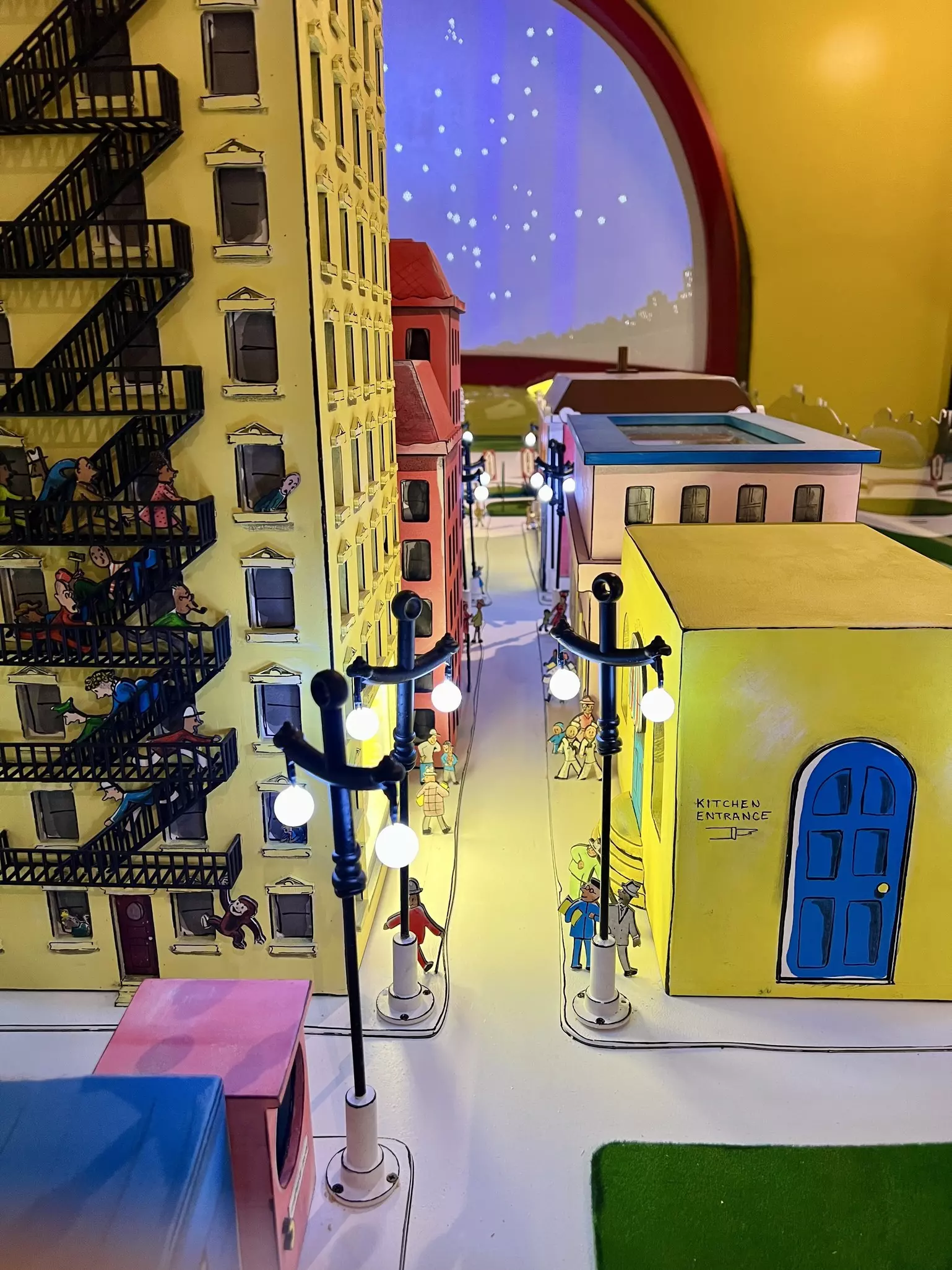 A cartoon city with people walking down the street.