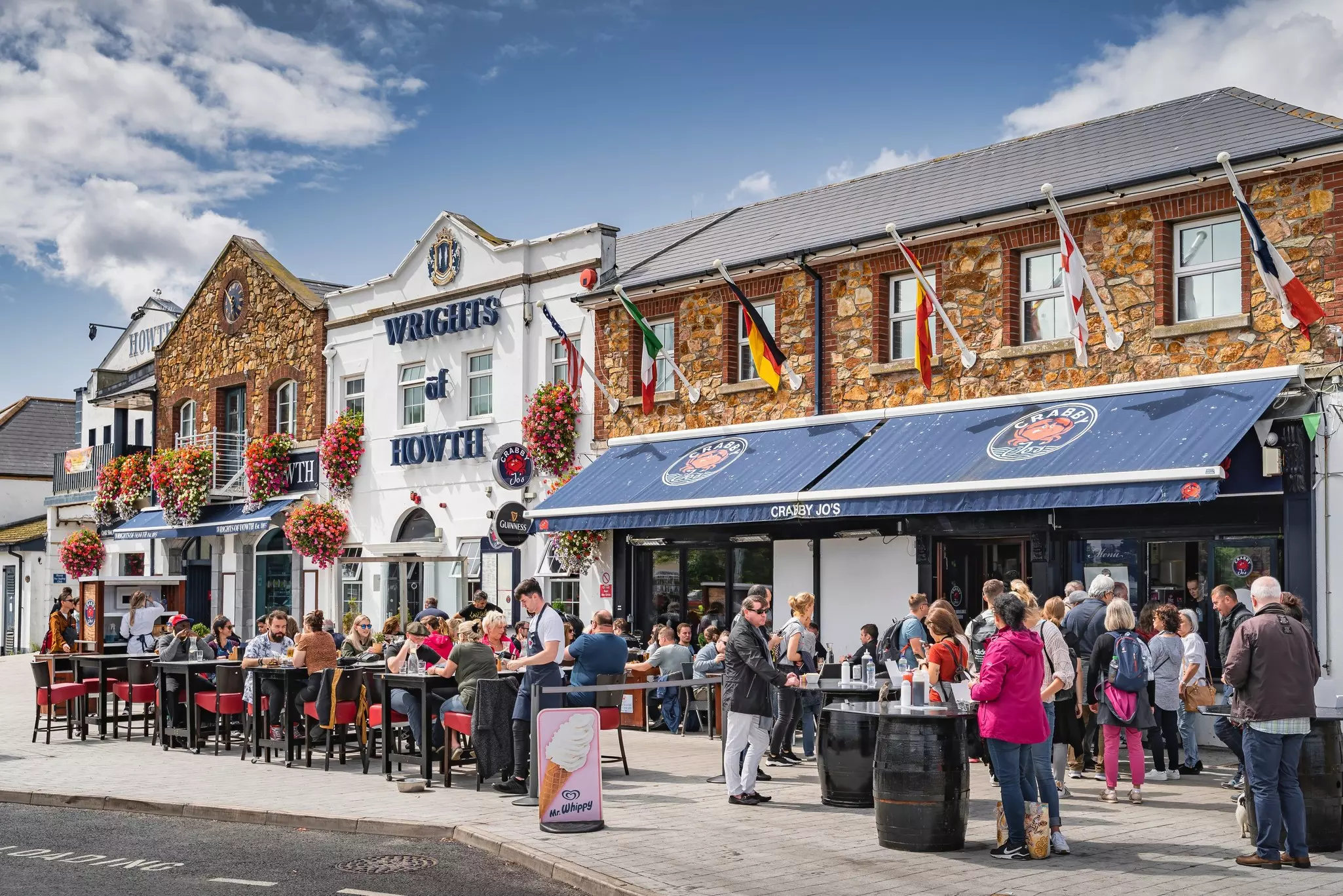 People enjoying outdoor dining in Howth.