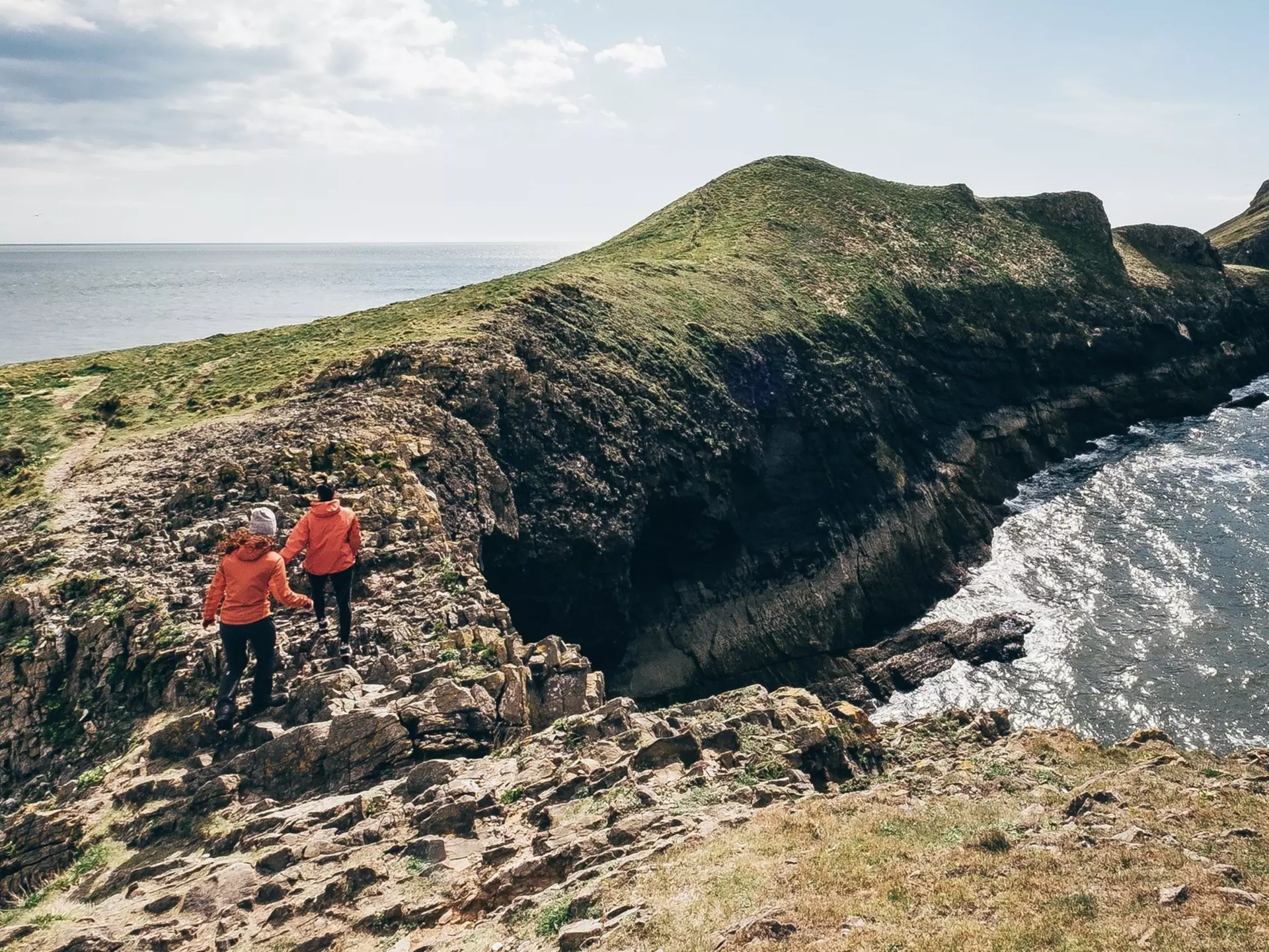 Hiking at Rhossili Bay, Wales. attilio pregnolato/Shutterstock