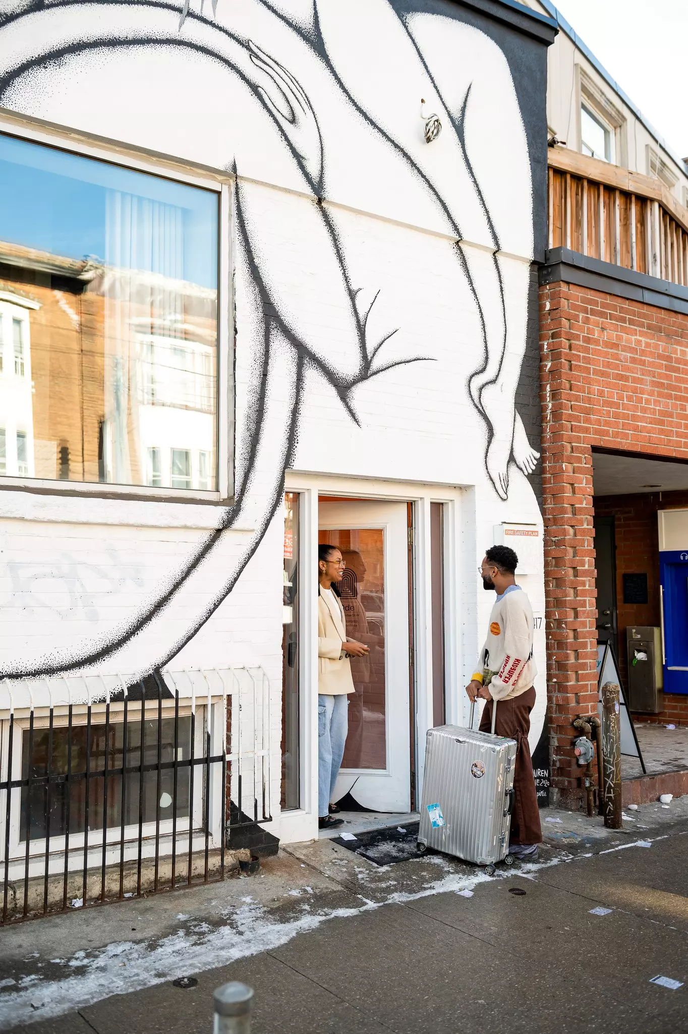 Tiffany Ramsubick welcomes a visitor to Ode, a family-owned boutique hotel in Toronto that revels in its ties to the neighborhood © Ryan Fung/Lonely Planet