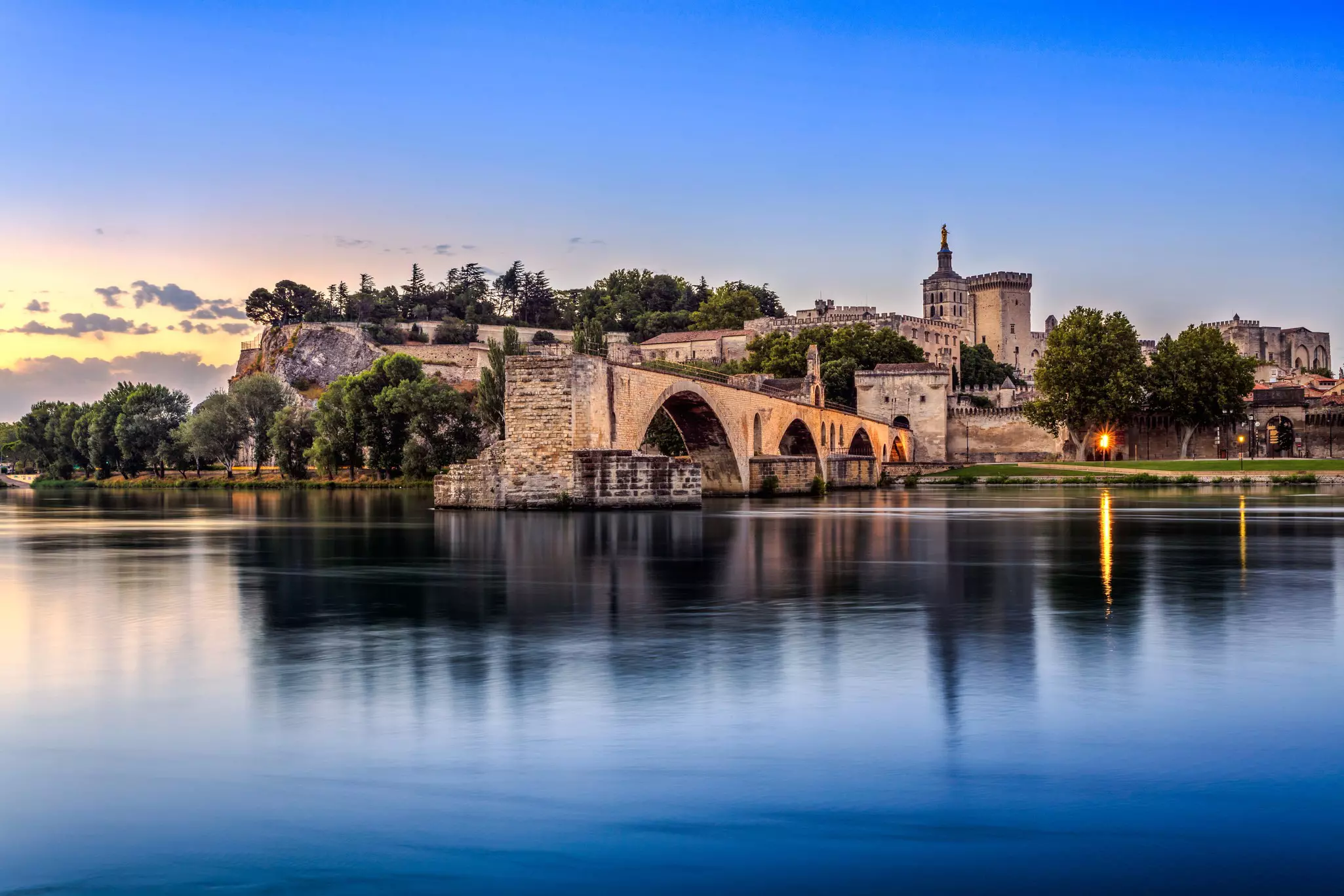 Avignon Bridge with Popes Palace and Rhone river at sunrise, Pont Saint-Benezet, Provence, France.