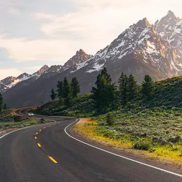 A winding road leads to the Teton Mountain Range at sunset in Grand Teton National Park, Wyoming.,,
{'11': 'Mountain', '12': 'Mountain range', '13': 'Mountains', '14': 'Nature', '15': 'Outdoors', '16': 'Road', '17': 'Scenery', '18': 'Scenic drive', '19': 'Sunlight', '0': 'Grand teton national park', '1': 'Jackson hole', '2': 'Teton', '3': 'Wyoming', '4': 'National park', '5': 'Clouds', '6': 'Drive', '7': 'Golden hour', '8': 'Highway', '9': 'Jackson', '20': 'Sunset', '10': 'Landscape', '21': 'Teton range'}