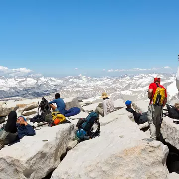 MOUNT WHITNEY, CA - JUNE 30: Hikers rest after a strenuous climb on June 30, 2010, on the summit of Mount Whitney. In 2009 ca. 25,000 people summited the highest peak in the continental United States., License Type: media, Download Time: 2025-08-04T20:29:27.000Z, User: meg3348277, Editorial: true, purchase_order: 56530 - Guidebooks, job: Global Publishing-WIP, client: Lonely Planet 'California 11, other: Megan Cassidy