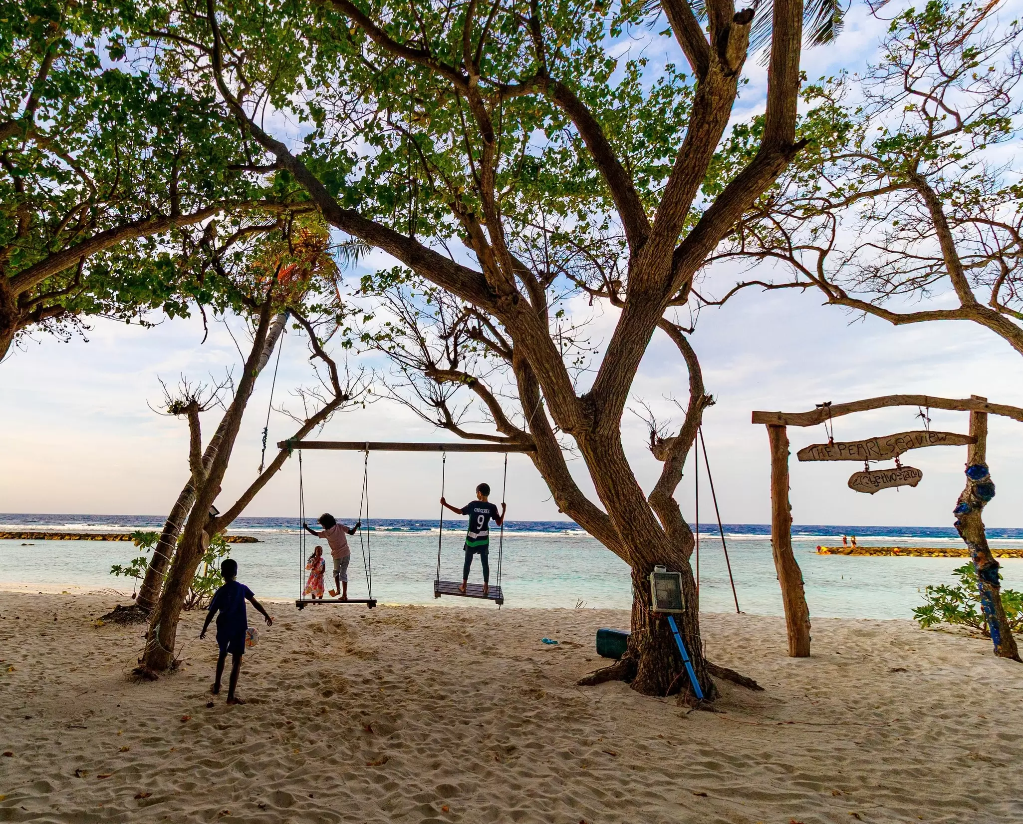 Children play on a quiet beach. Levon Avagyan/Shutterstock