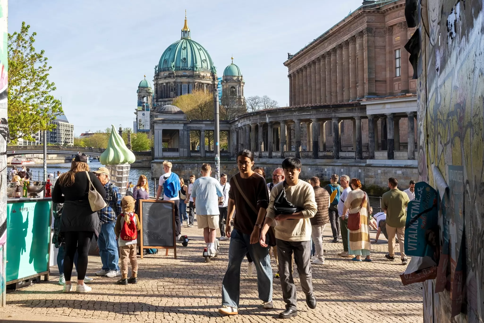 People walk near Museumsinsel. Elena Rostunova/Shutterstock
