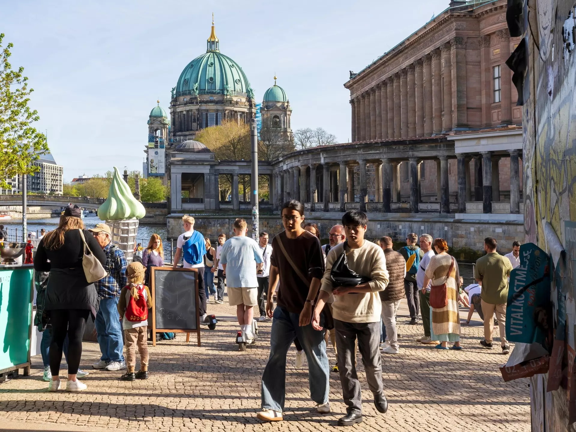People walk near Museumsinsel. Elena Rostunova/Shutterstock