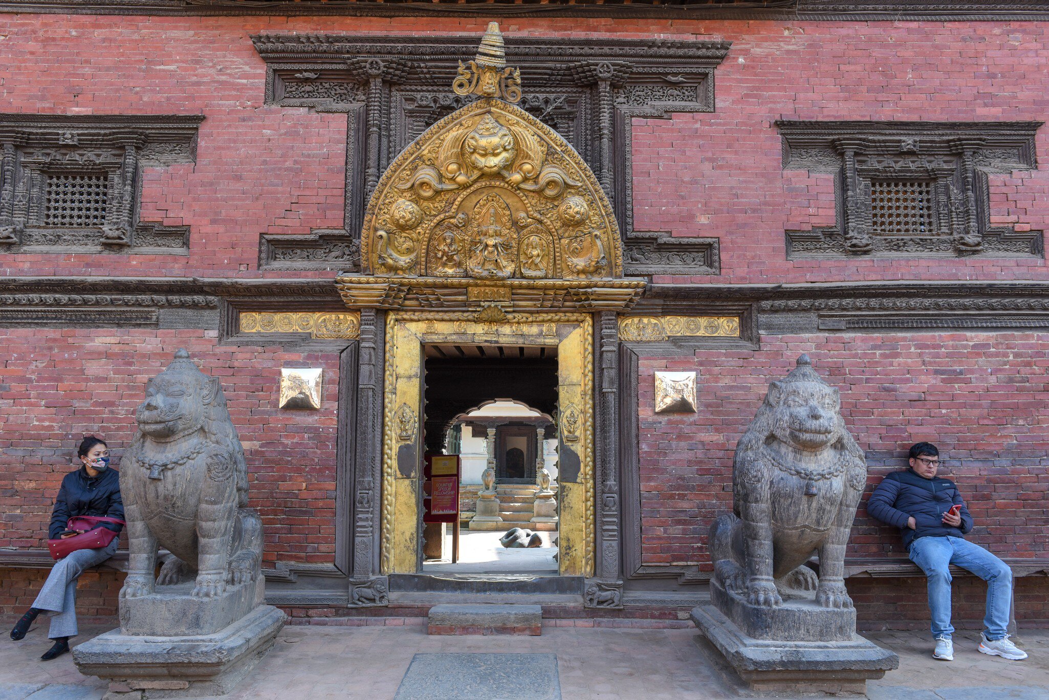 Patan, Nepal - 24 January 2020: Golden door of the temple at Durban square on Patan near Kathmandu in Nepal