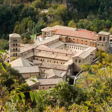 View of Saint Scholastica medieval monastery surrounded, by trees in Subiaco. Founded by Benedict of Nursia .; Shutterstock ID 1736371556;