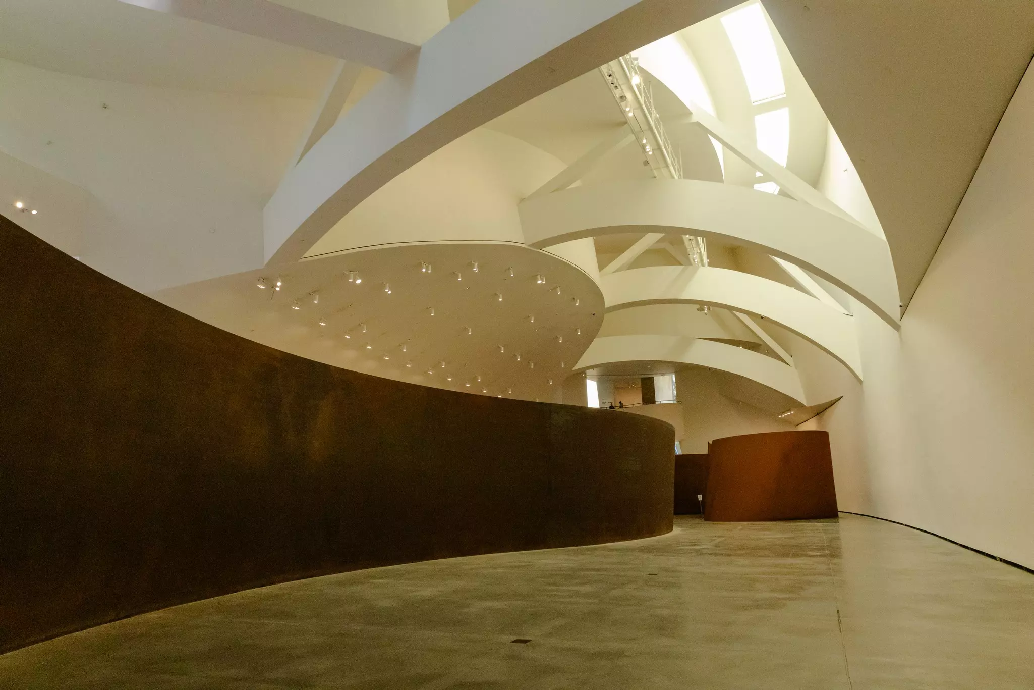 An ornate ceiling with natural light coming through in the Guggenheim Museum in Bilbao, Spain