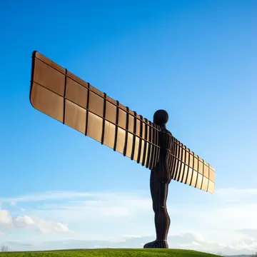 GATESHEAD, UK - MARCH 27, 2016. The Angel of the North, Gateshead. A steel sculpture by Antony Gormley, stands 66 feet high with a wing span of 177 feet. The sky is blue, the Angel isolated.
404670181
angel, antony, artwork, blue, crowd, england, figure, gateshead, gormley, heritage, icon, industrial, isolated, landmark, metal, modern, monument, newcastle, north, northumberland, sculpture, sky, steel, structure, summer, tall, tourist, tyne, uk, wear