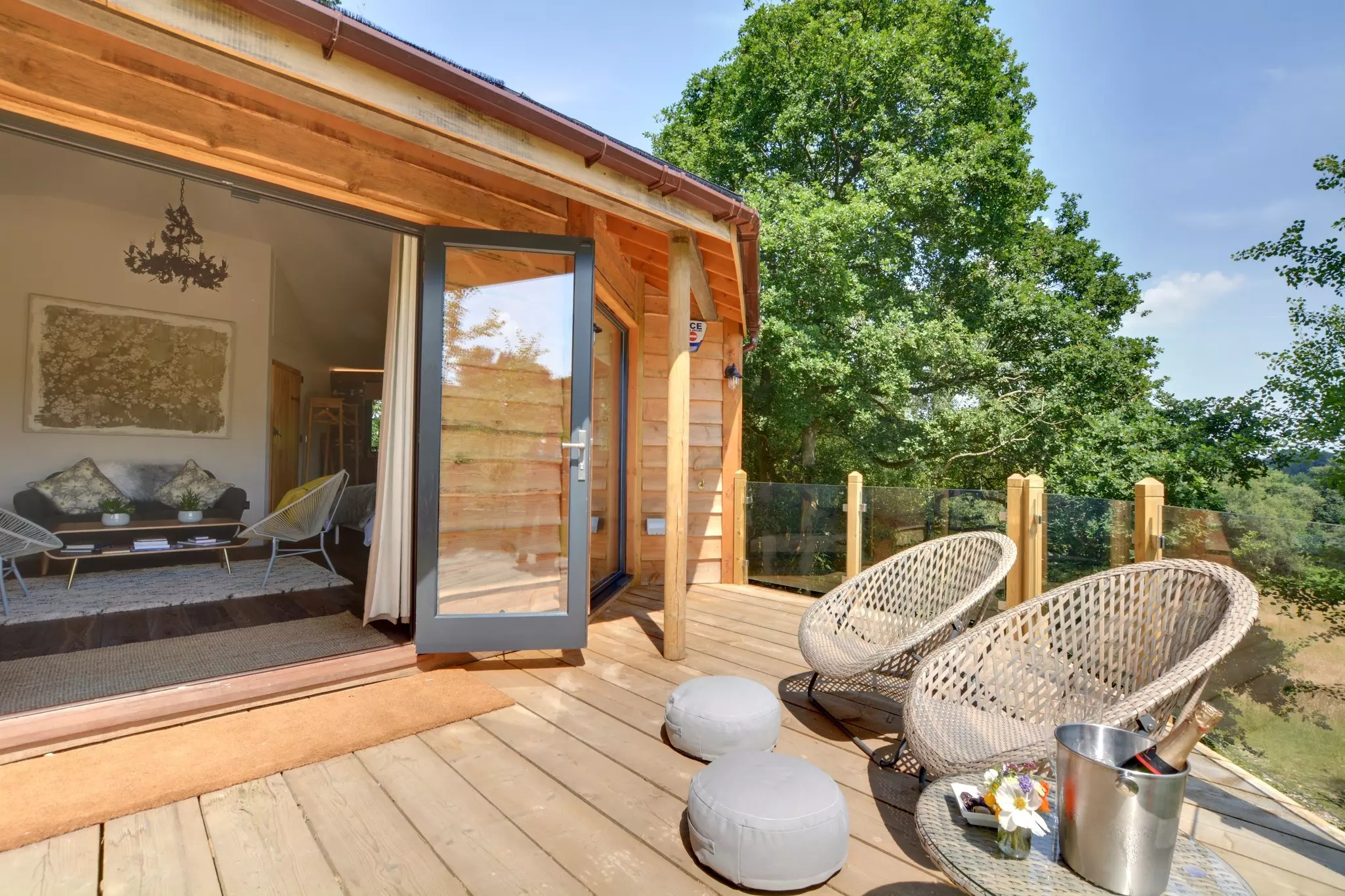 Relax on the treehouse deck surrounded by private woodland at Oakey Koakey © Oakey Koakey Treehouse / Canopy & Stars