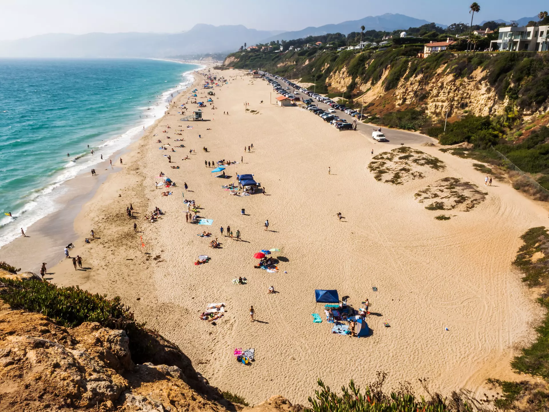 Seagulls and beachgoers on Zuma Beach, Los Angeles, California. 