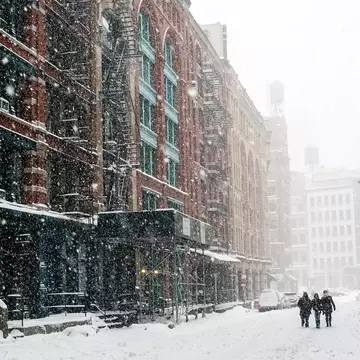 Snow-covered street during winter in New York City. Shutterstock